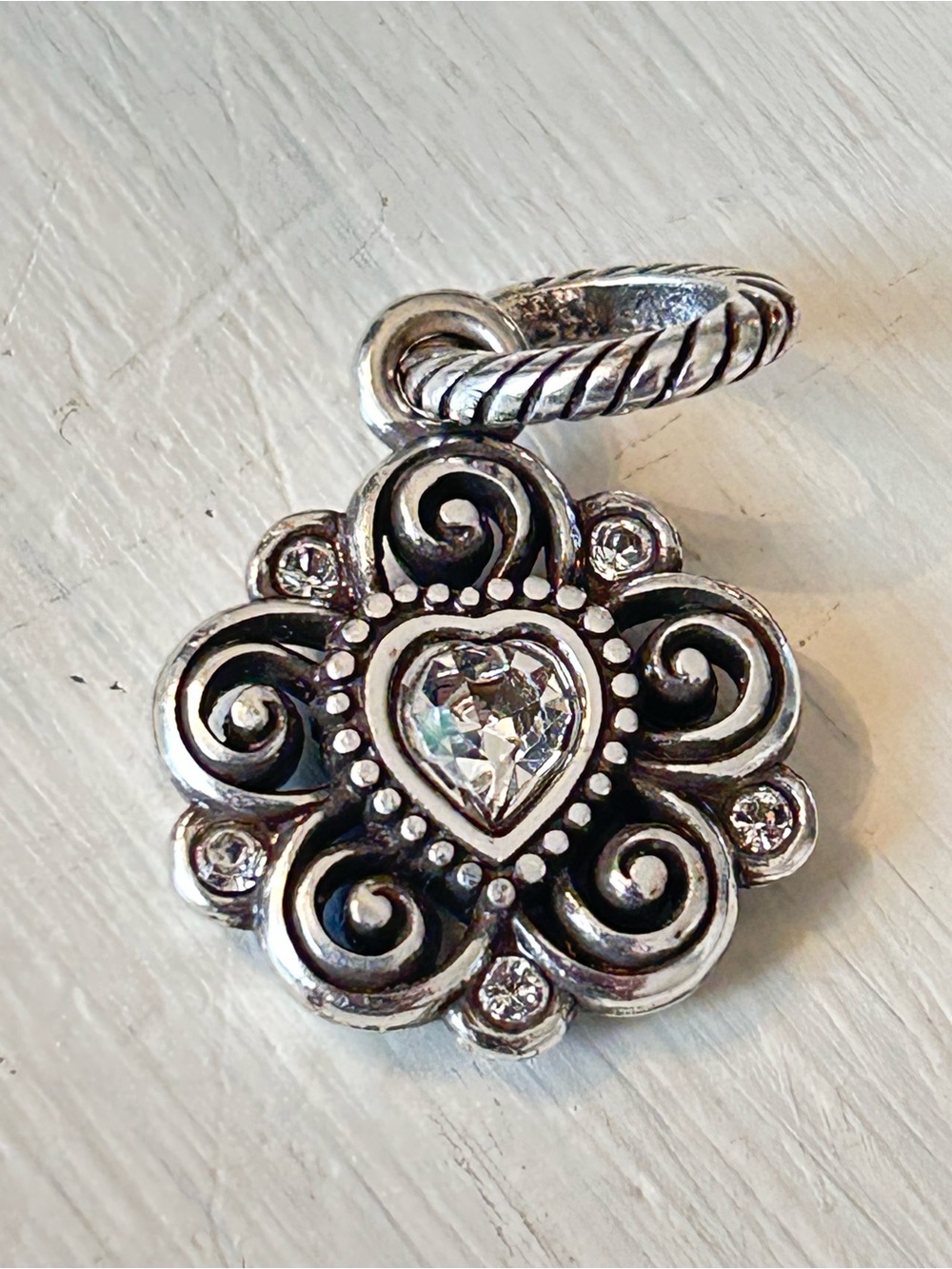 Brighton reversible charm featuring a floral design w/April birthstone
